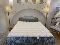 Перина пуховая 2 см Elanna - Dorbena (Лихтенштейн) с уплотнёными центральными кассетами - артикул 41447